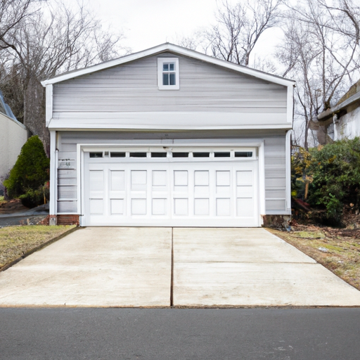 Suburban Fort Lee, NJ home with a closed residential garage door, clean driveway and neutral facade under soft overcast light.