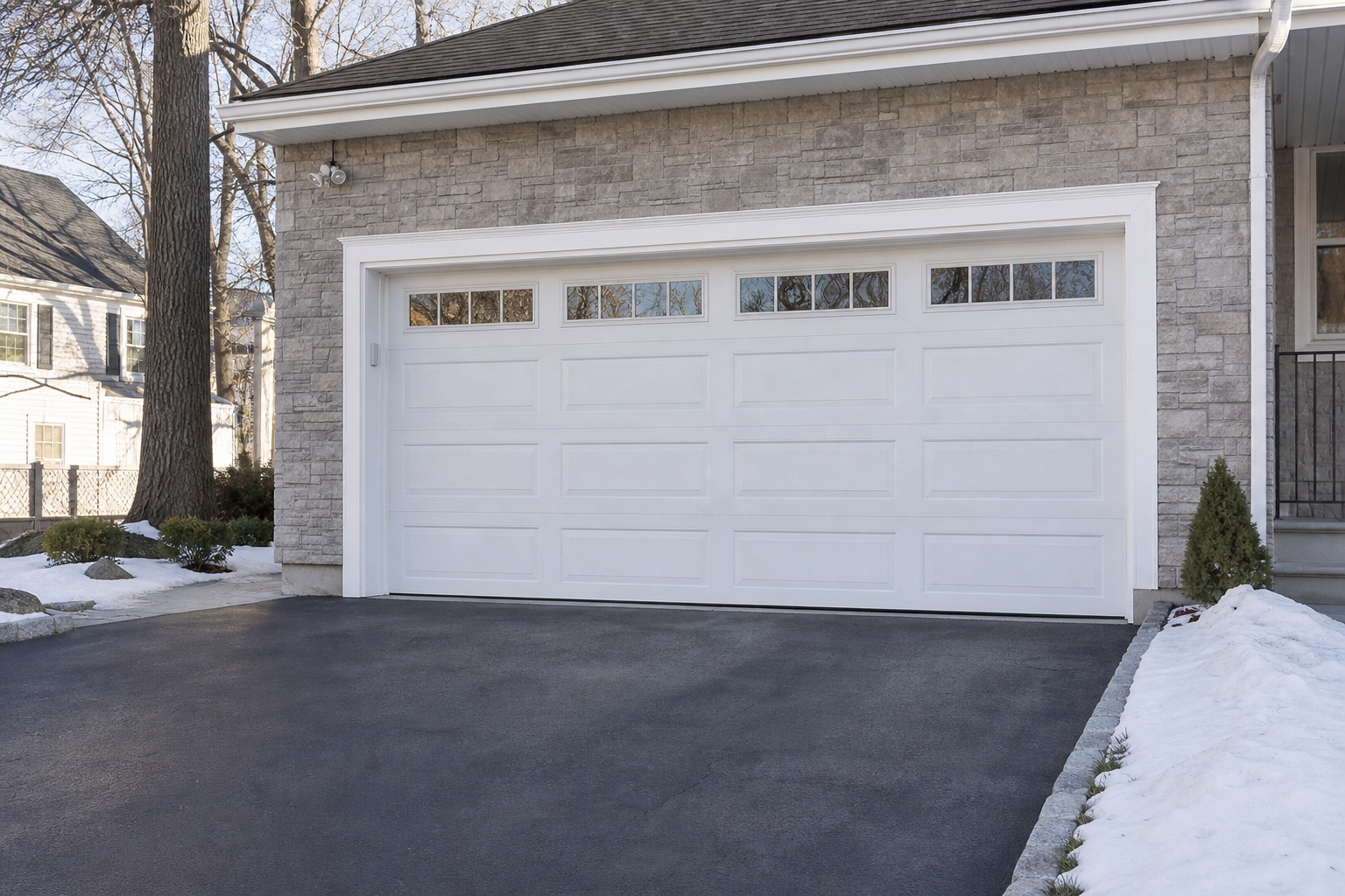 Garage door exterior in Fort Lee, NJ with a sealed residential door and driveway